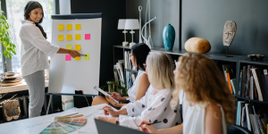 Woman detailing business strategy to team