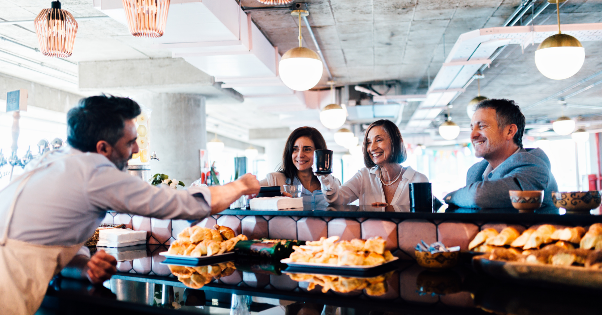 customers paying in a cafe